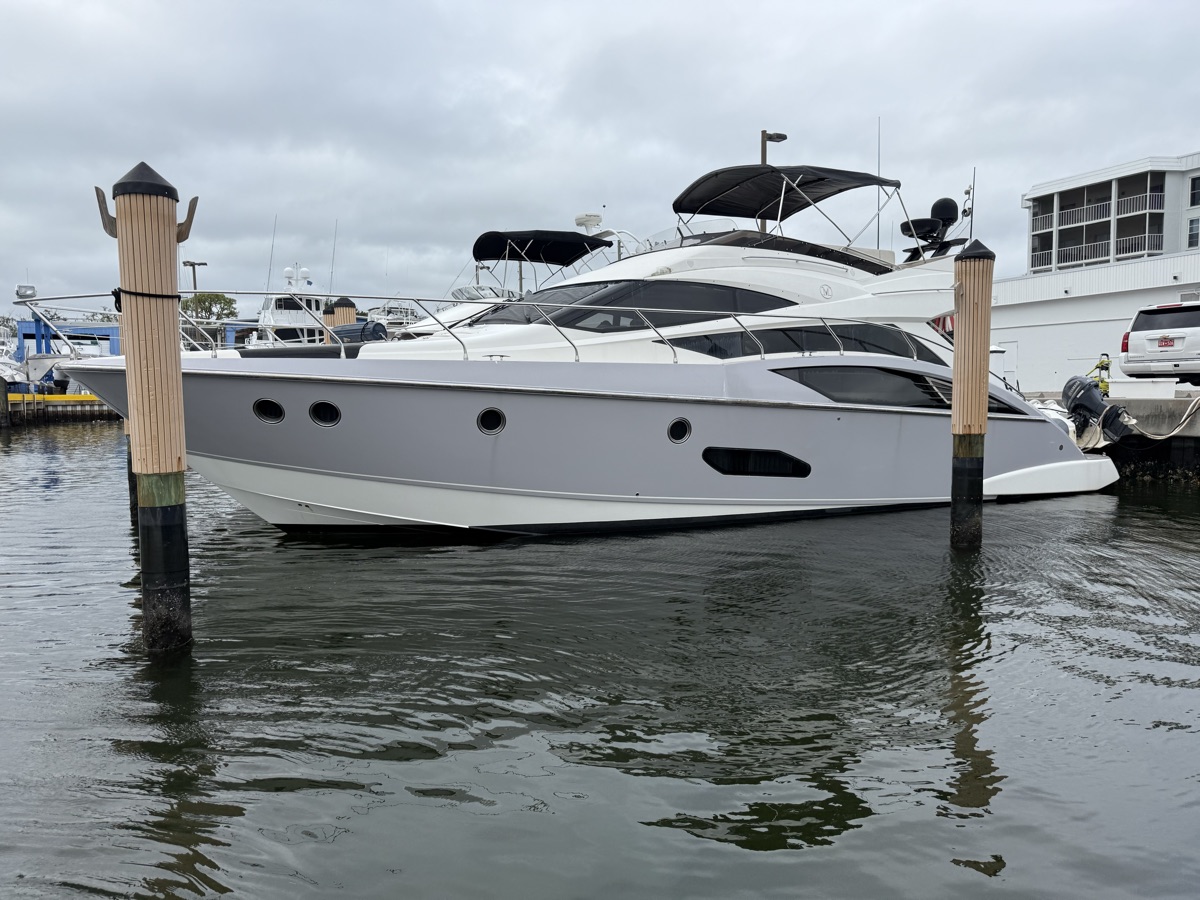 Yacht at her slip in the marina, water-level view